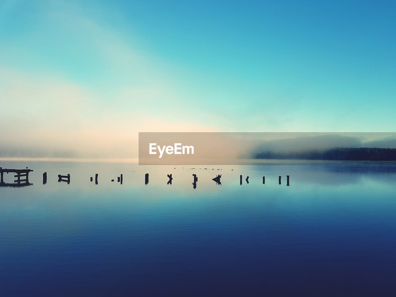 Scenic view of lake ukiel against sky during sunrise