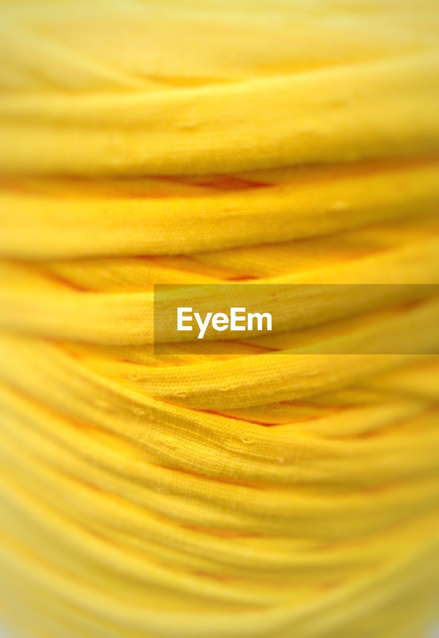 Detail shot of yellow wool yarn