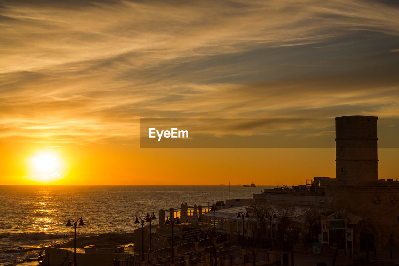 Scenic view of sea at sunset