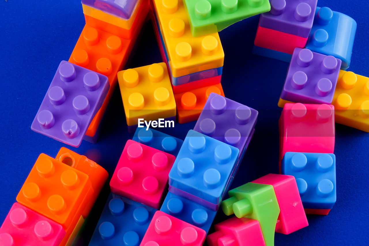 Close-up of toy blocks on blue background