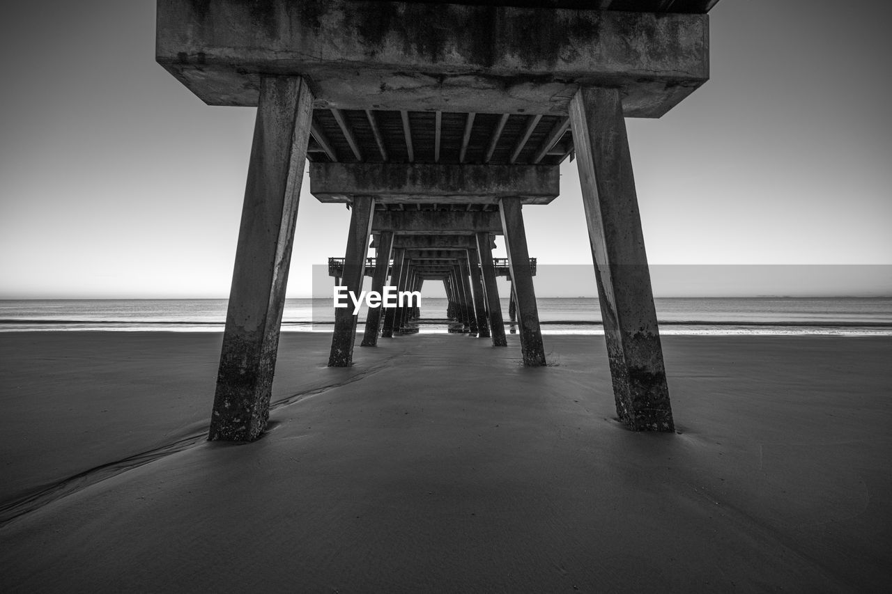 Pier over sea against sky