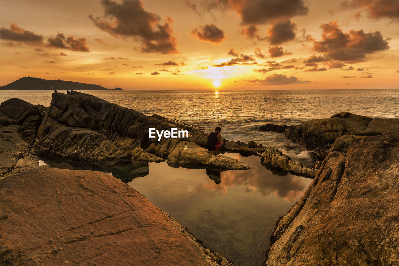 Scenic view of sea against sky during sunset
