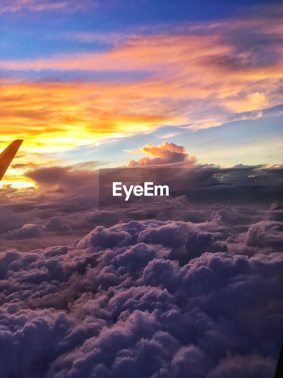 AERIAL VIEW OF CLOUDS OVER LANDSCAPE