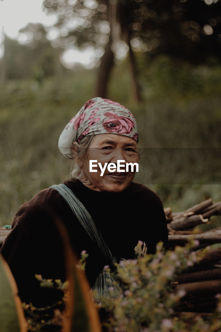 Portrait of old woman wearing hat