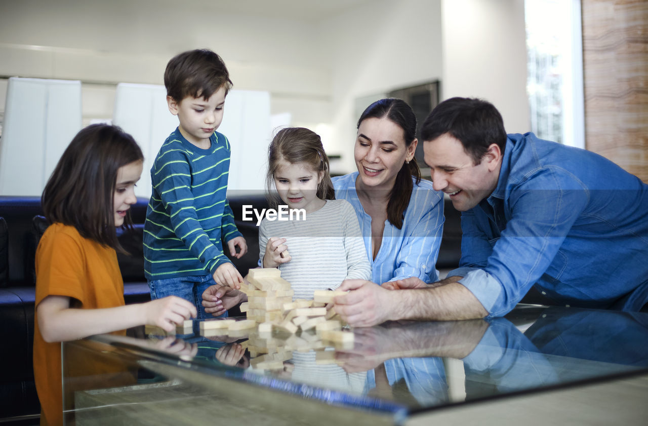 female friends working on table at home