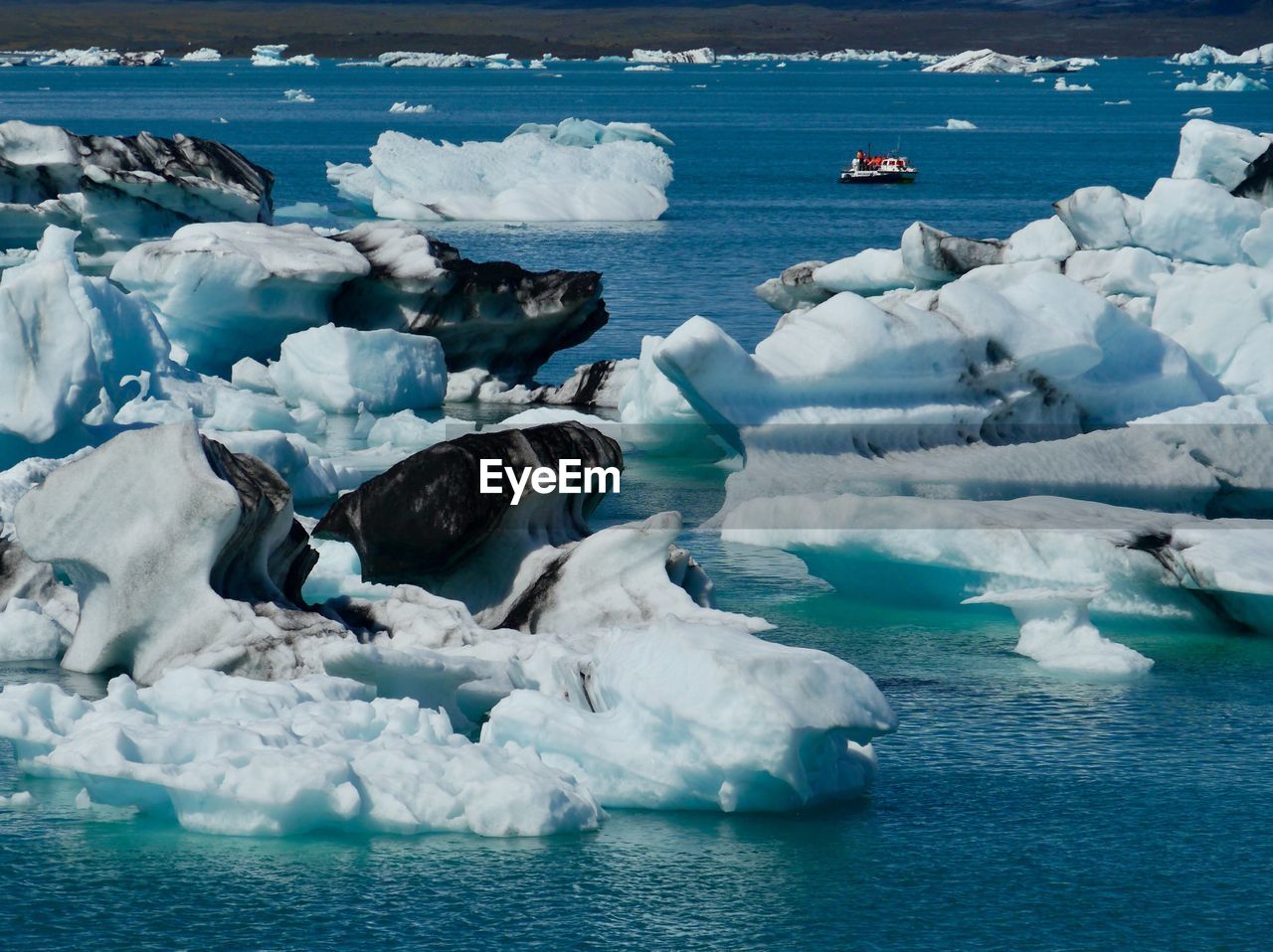 SCENIC VIEW OF FROZEN SEA FROM CONTAINER