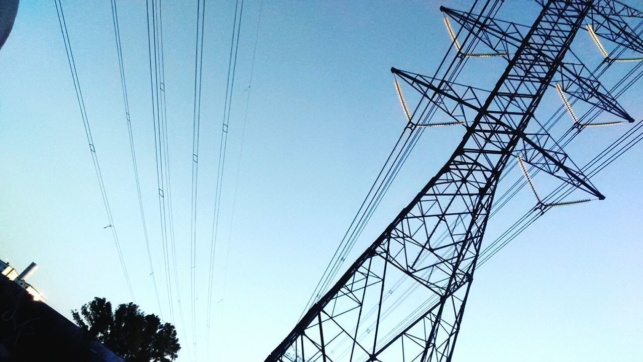 LOW ANGLE VIEW OF POWER LINES AGAINST CLEAR BLUE SKY