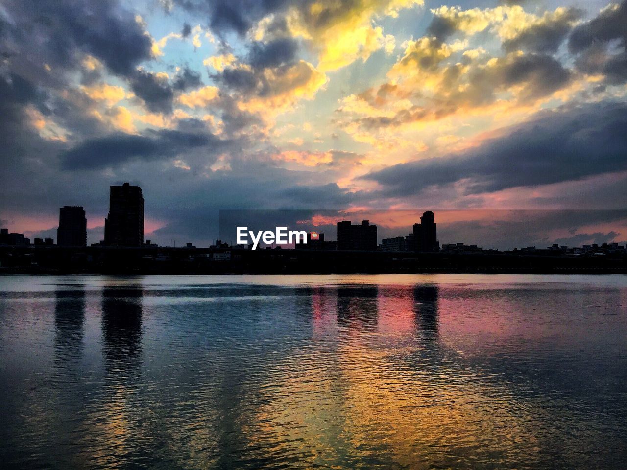 SILHOUETTE OF CITY AT WATERFRONT