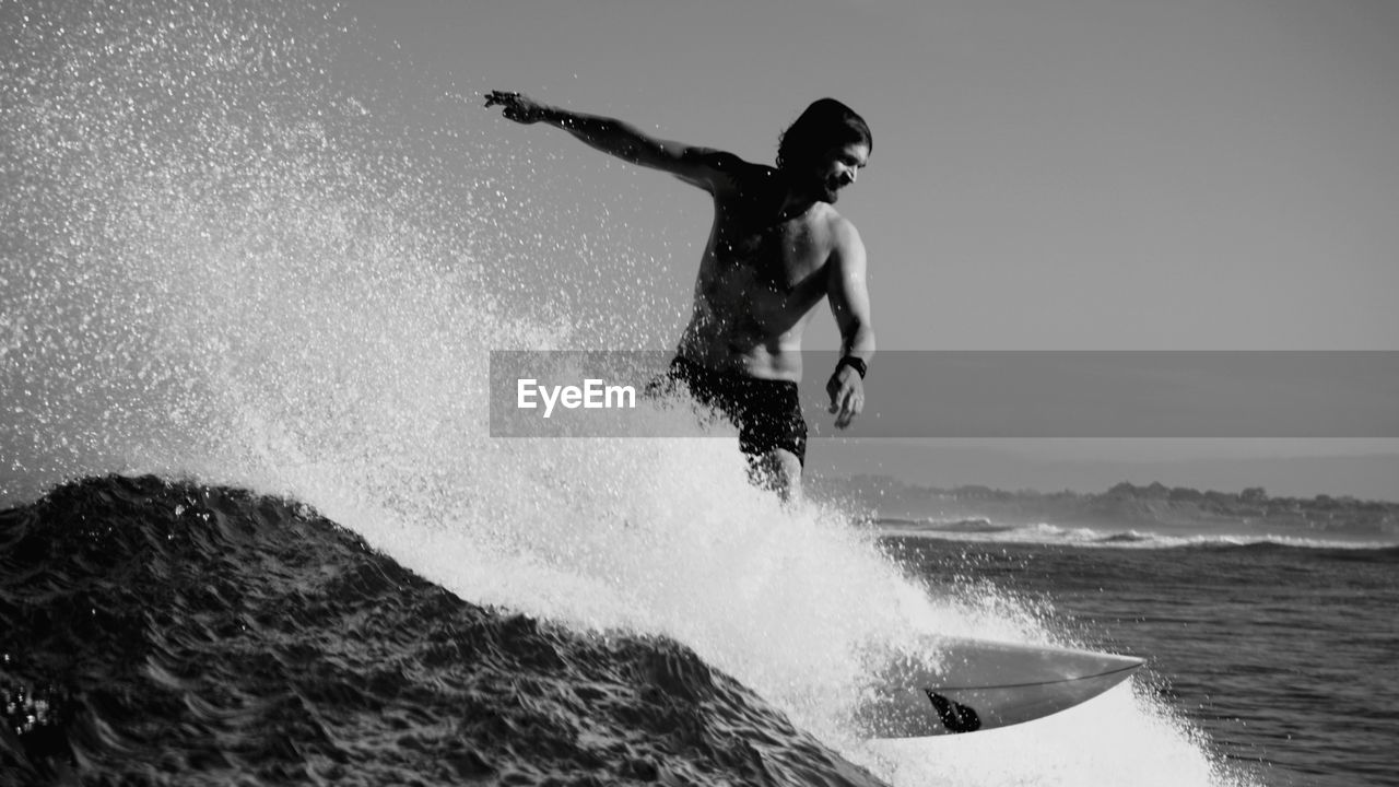 Low angle view of man surfing in sea