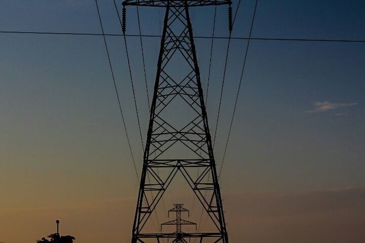 LOW ANGLE VIEW OF ELECTRICITY PYLONS AGAINST SKY