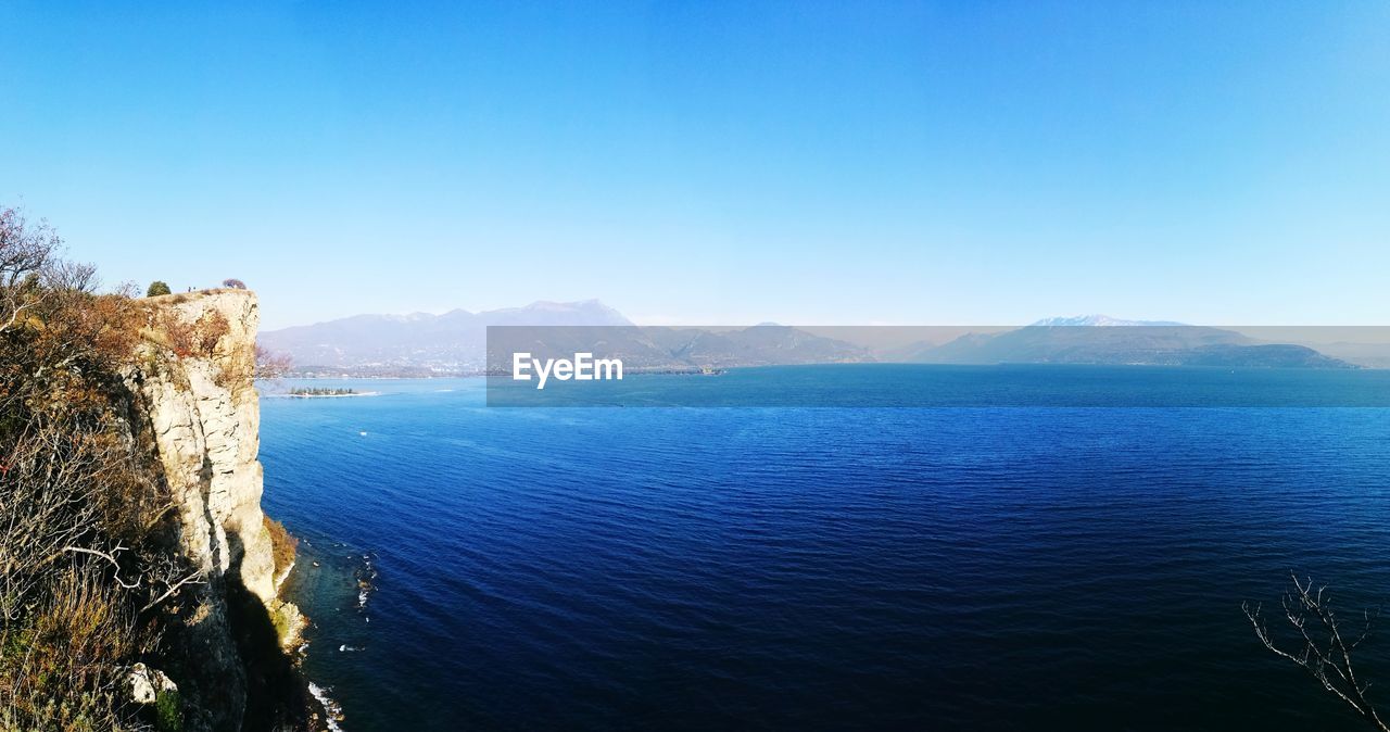 Scenic view of sea against blue sky