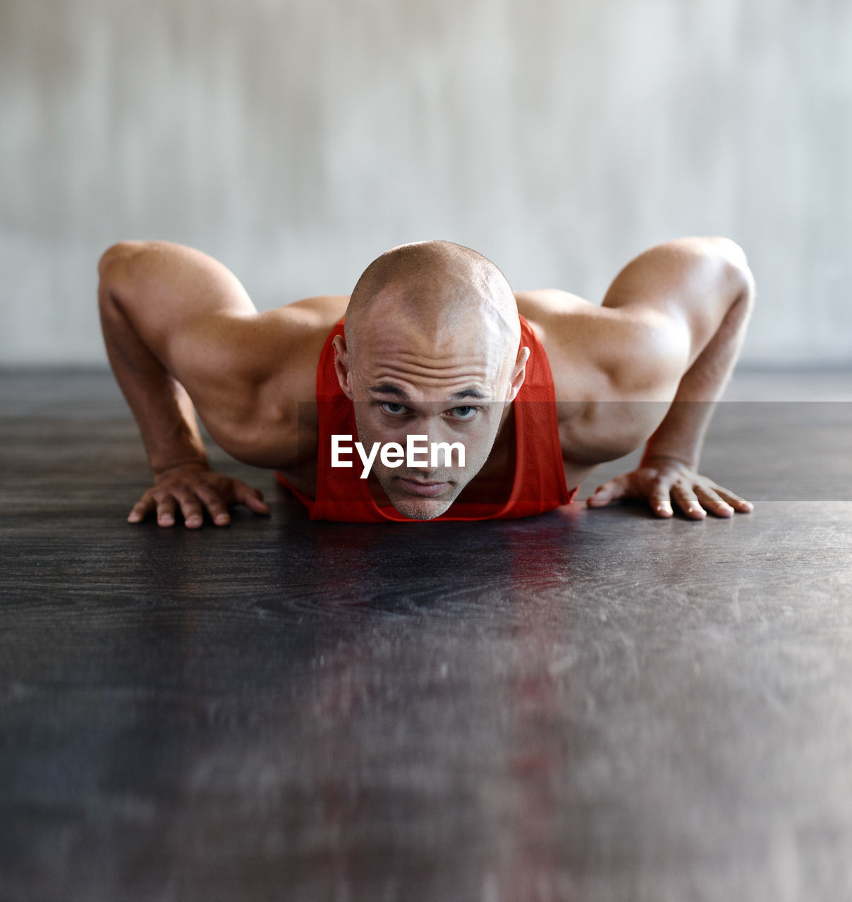 Portrait of man exercising at gym