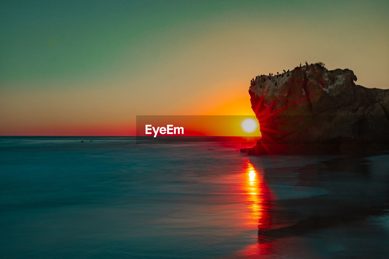 Scenic view of sunset at malibu beach 