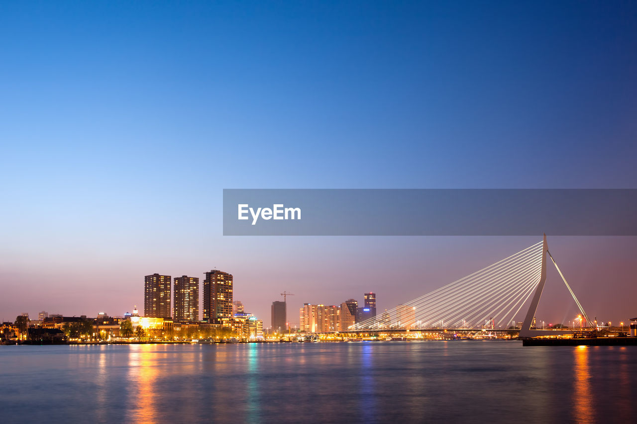 Illuminated city at waterfront