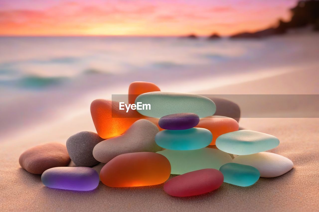 sunset, multi colored, land, beach, sea, sky, nature, no people, water, healthcare and medicine, sand, orange color, blue, environment, pill, petal, focus on foreground, dose, close-up, medicine, cloud, vibrant color