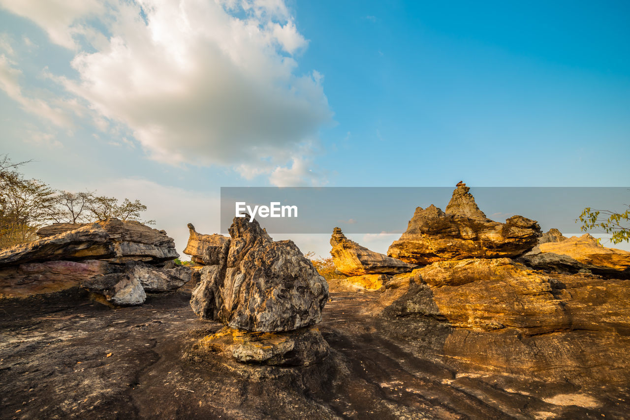 STACK OF ROCKS ON SHORE AGAINST SKY