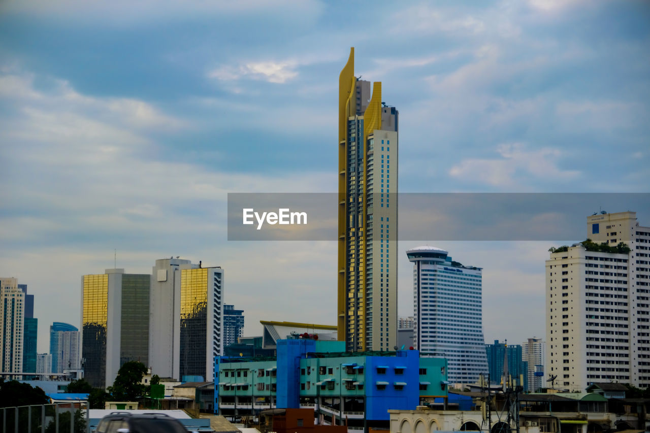 Modern buildings in city against sky