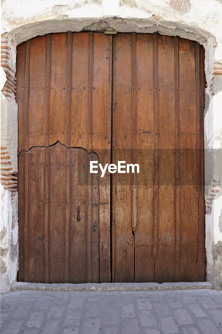 CLOSE-UP OF WOODEN DOOR