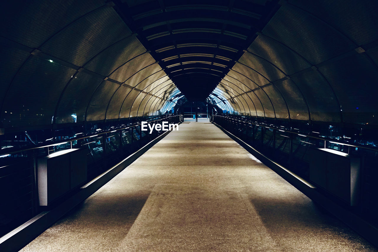 EMPTY ILLUMINATED TUNNEL WITH LIGHTS