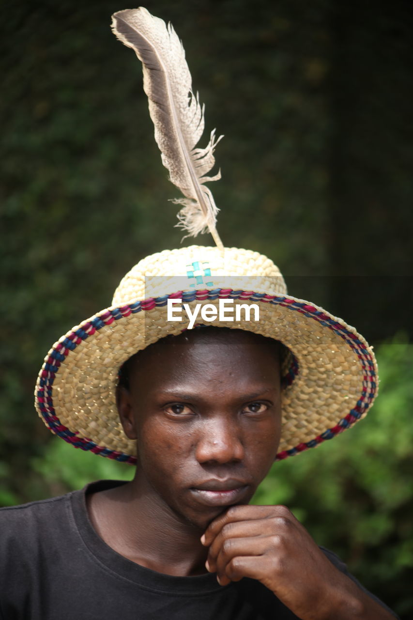 Portrait of young man wearing hat