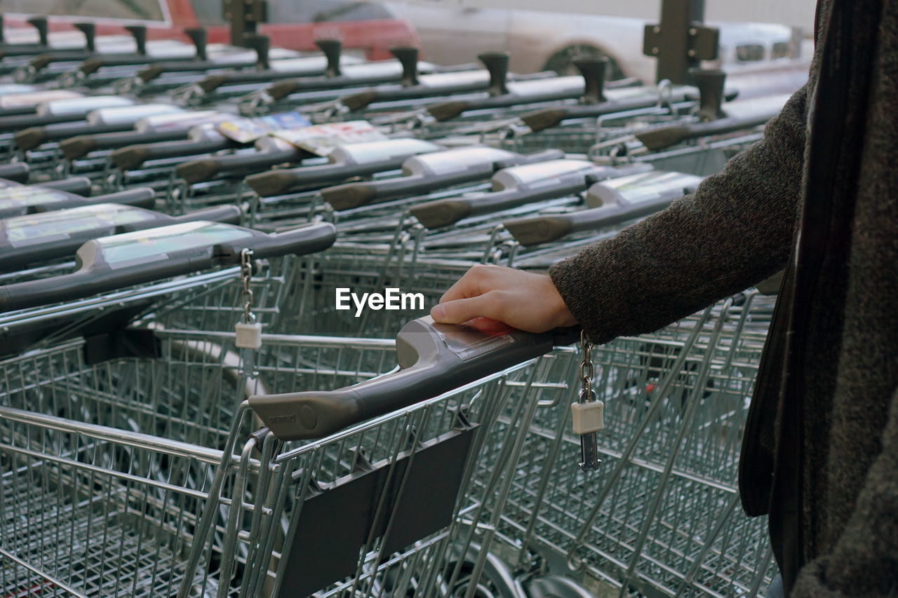 Shopping trolleys with man hand