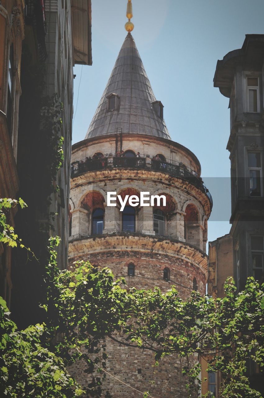 Low angle view of galata tower against clear sky