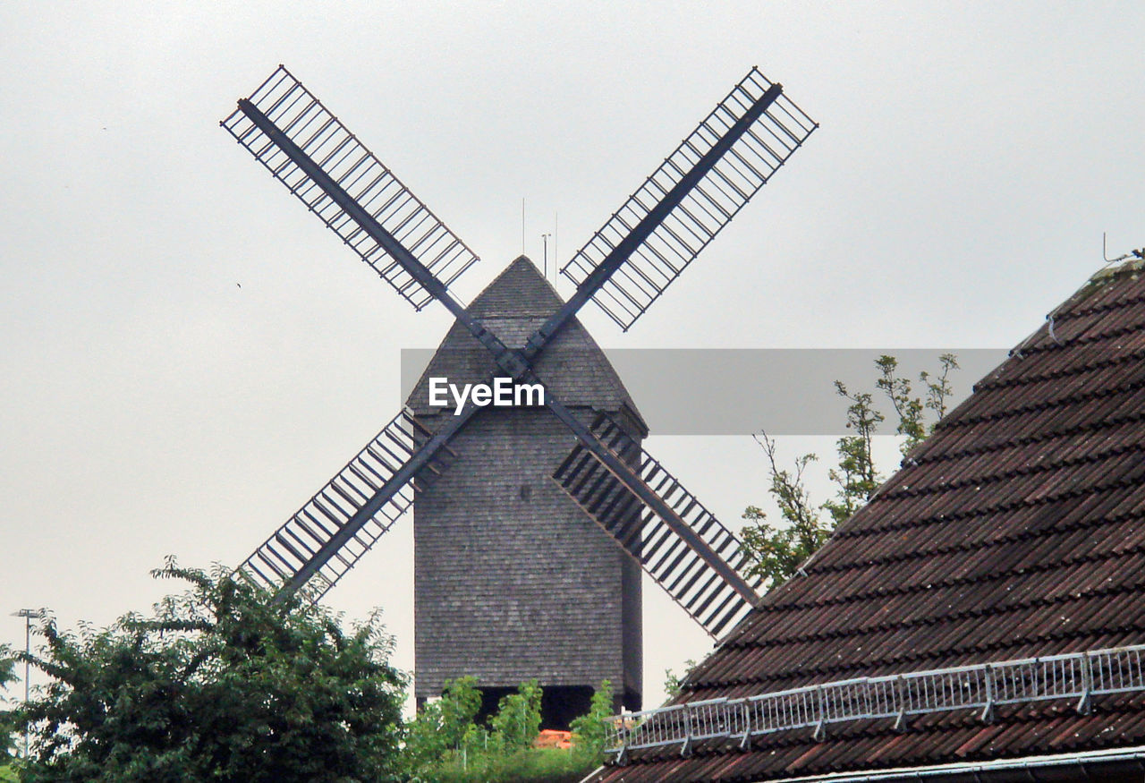 LOW ANGLE VIEW OF WINDMILL AGAINST SKY