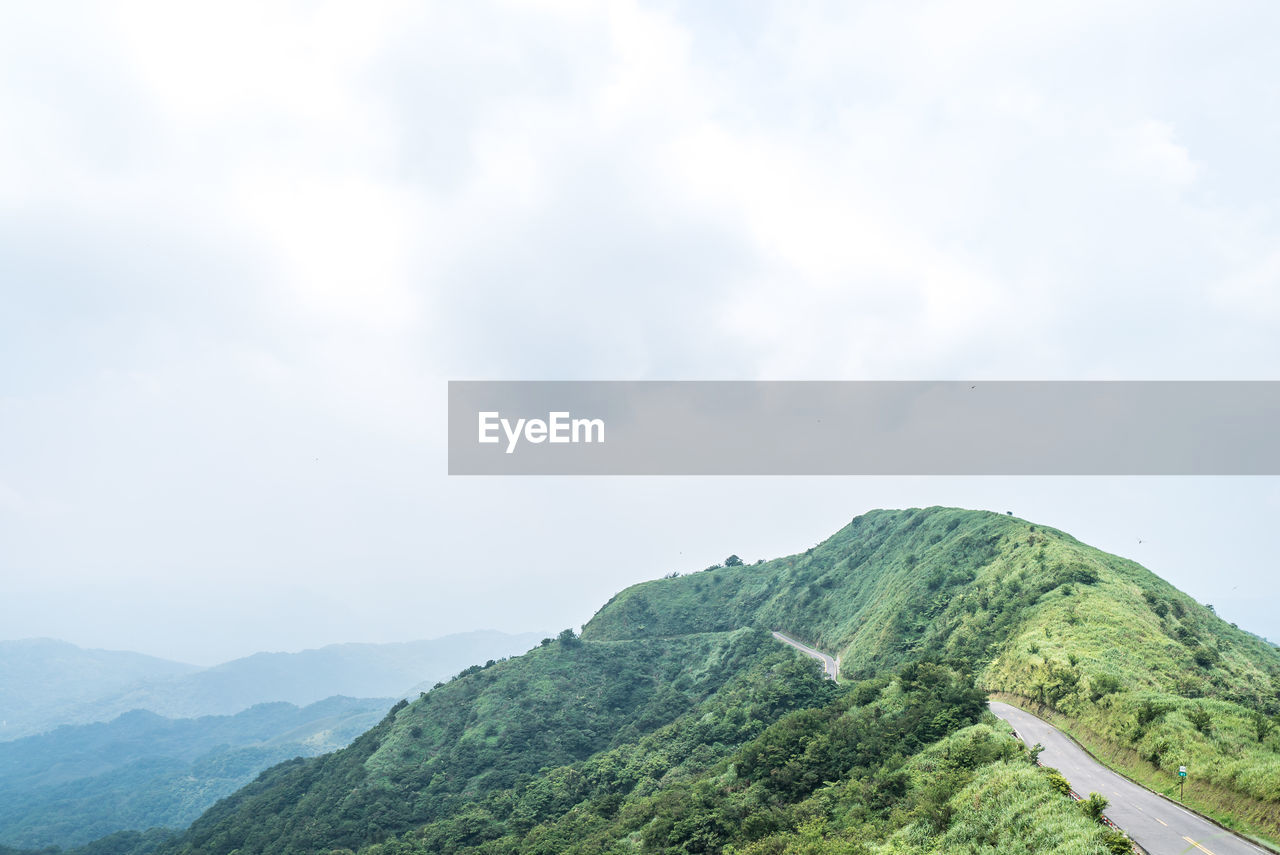 SCENIC VIEW OF MOUNTAIN RANGE AGAINST SKY