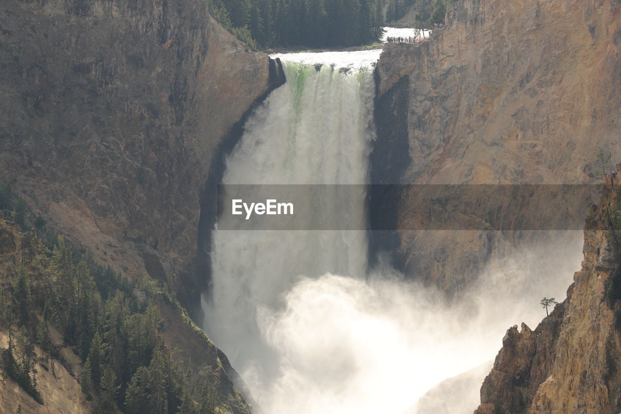 Scenic view of waterfall on mountain