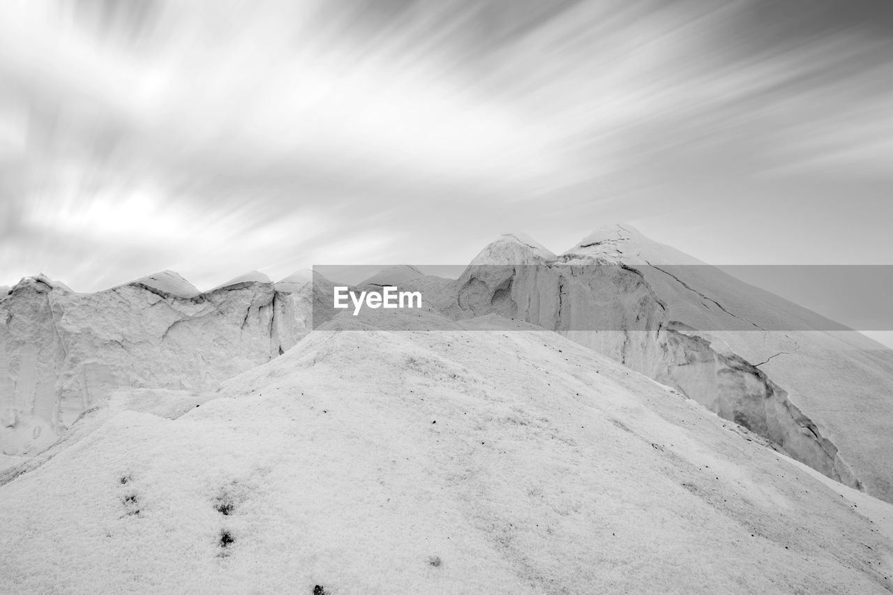 Scenic view of snow covered mountain against sky