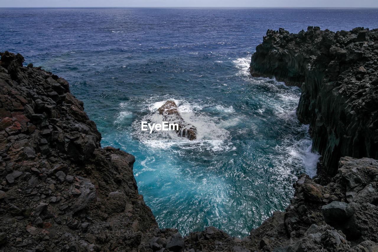 Scenic view of rocks in sea