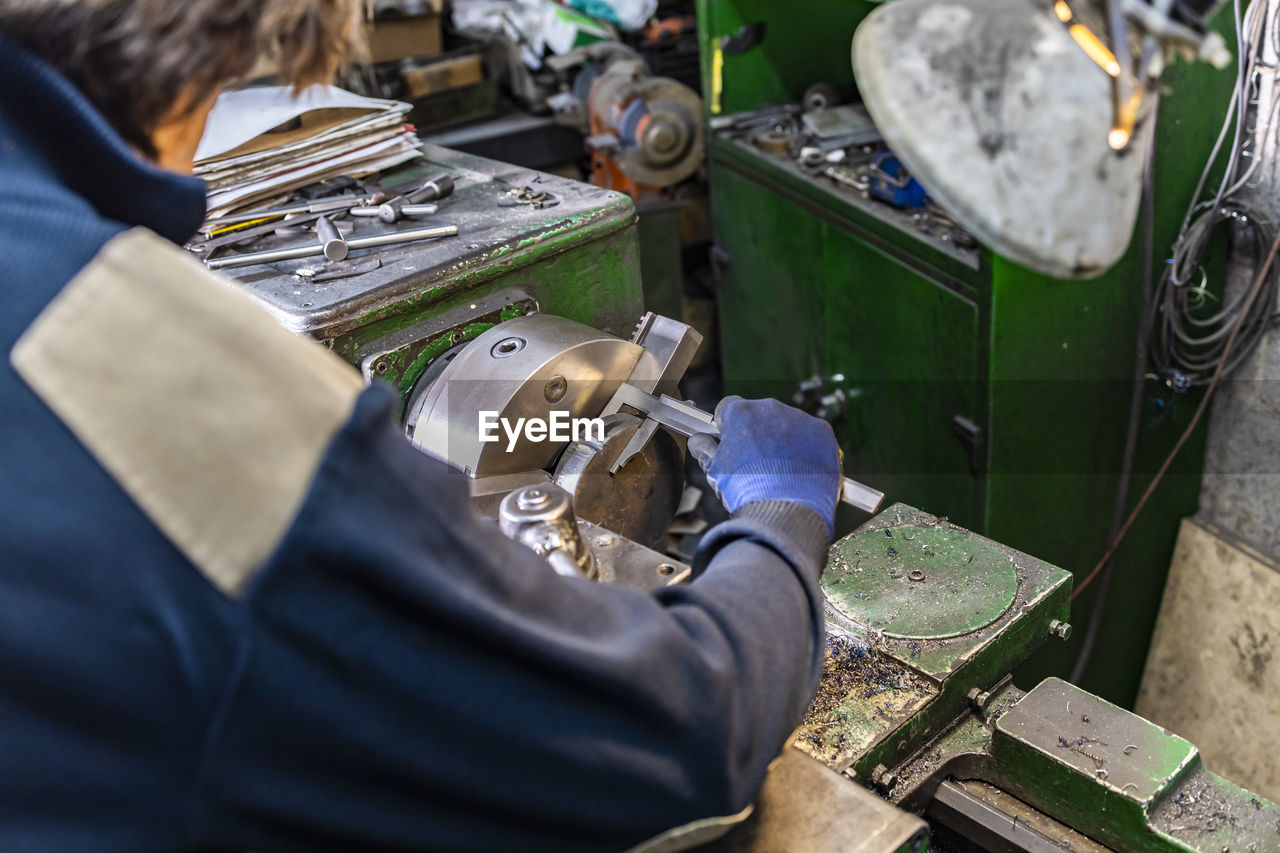 Cropped image of man working in workshop