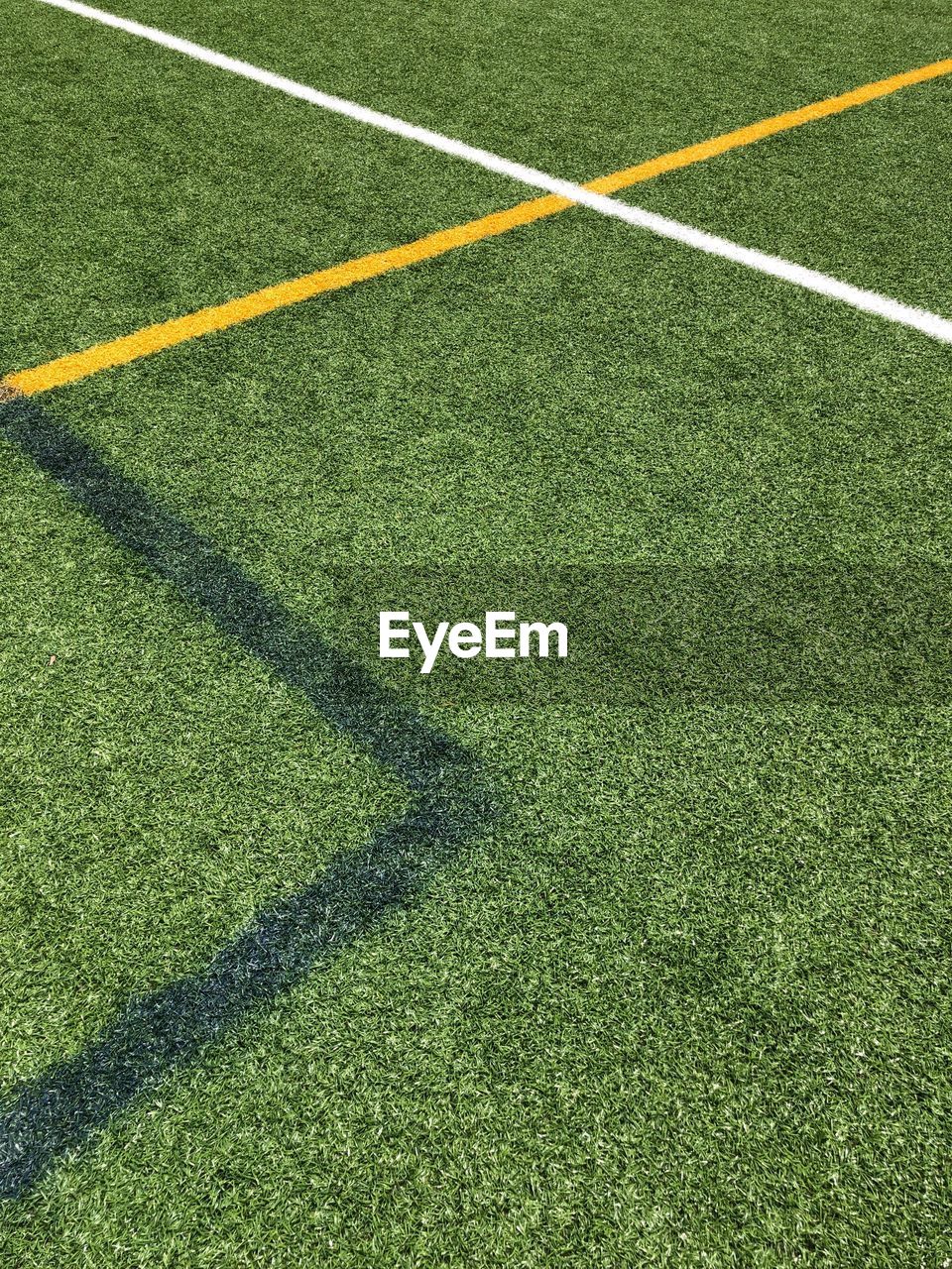 High angle view of soccer field during sunny day