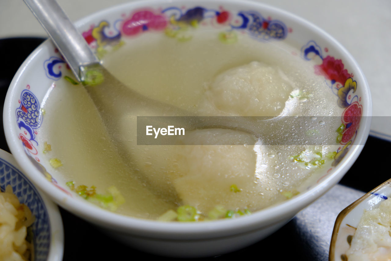 CLOSE-UP OF SOUP IN BOWL ON TABLE