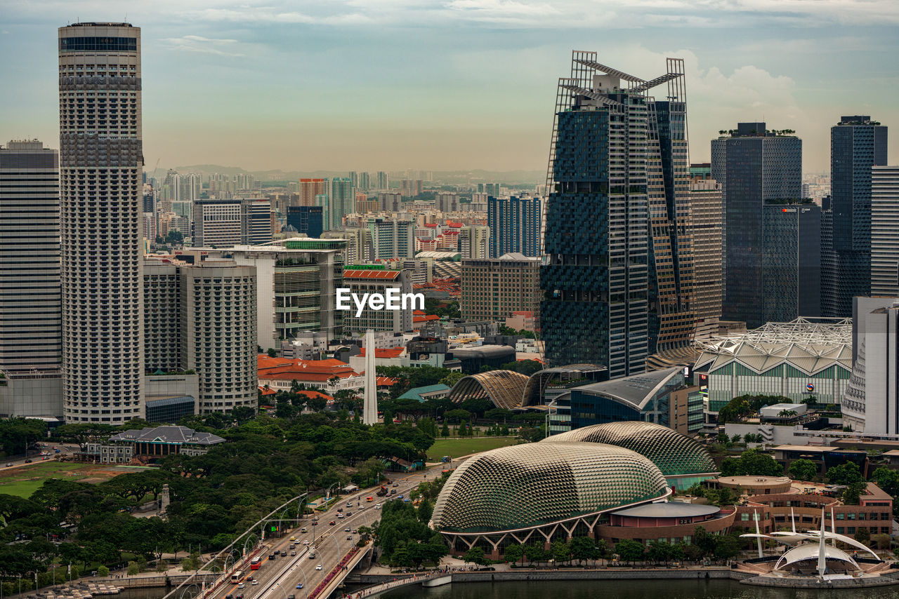 High angle view of buildings in city against sky