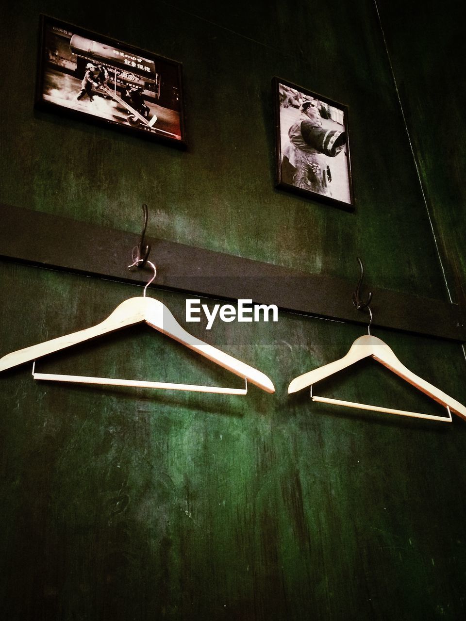 Close-up of empty coathangers on hooks