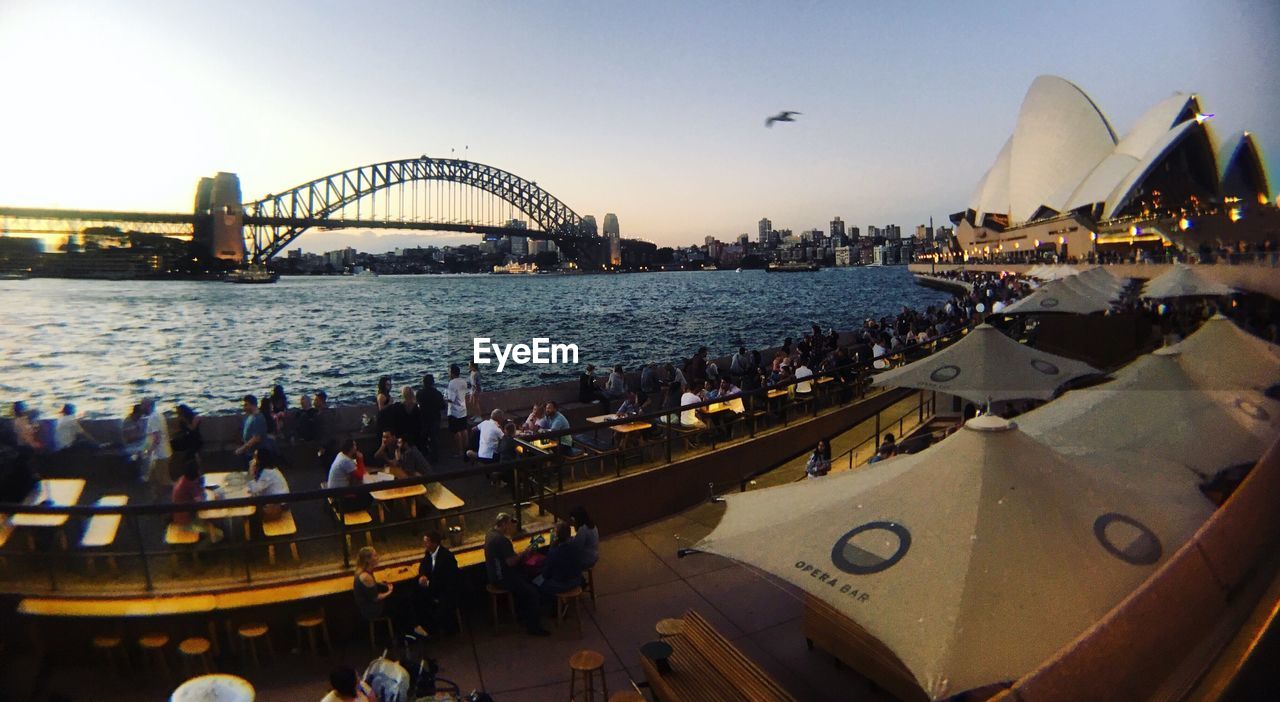 PANORAMIC VIEW OF BOATS IN CITY AT WATERFRONT