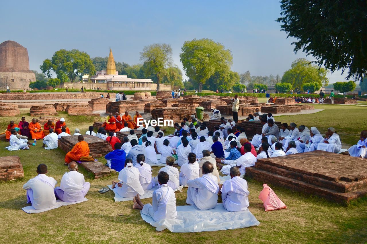 People praying while sitting at sarnath