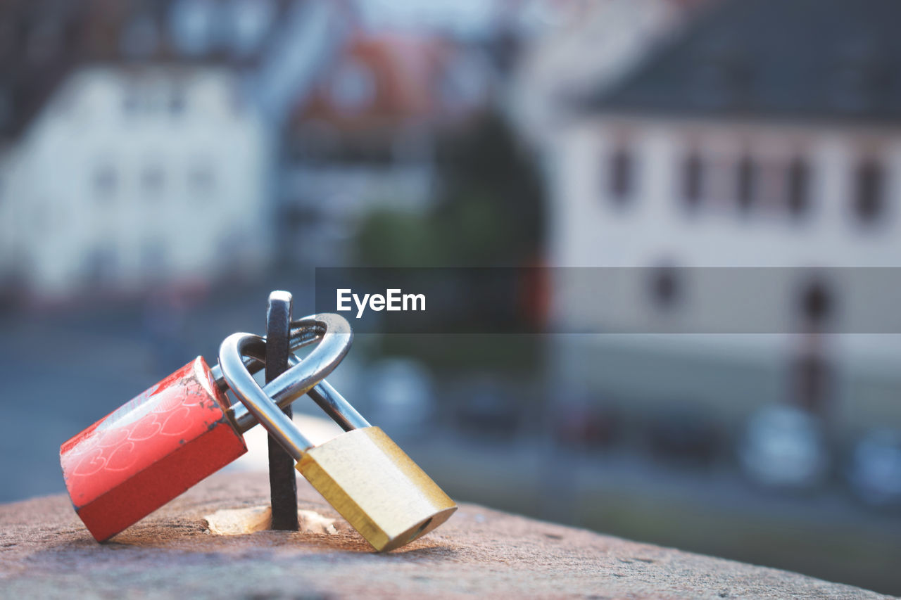 Close-up of love locks on retaining wall