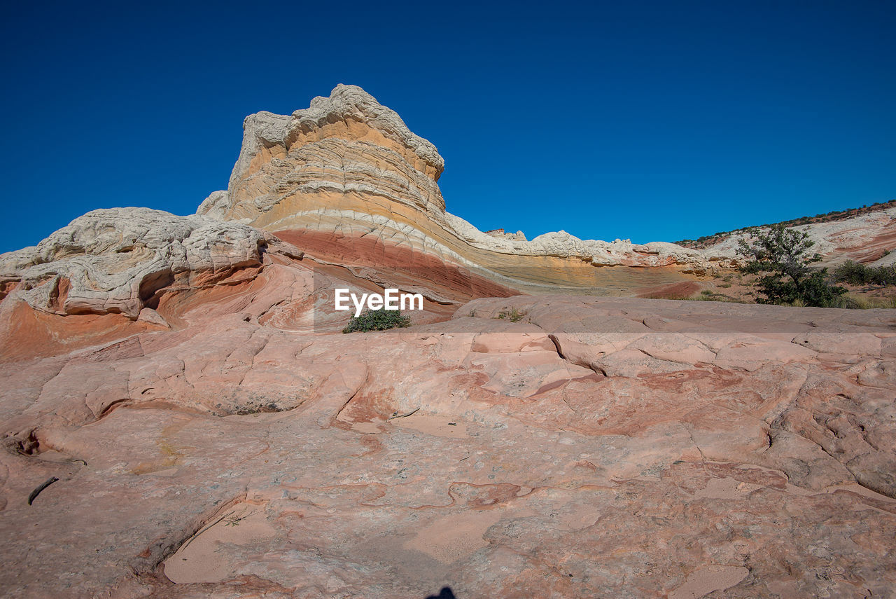 LOW ANGLE VIEW OF ROCK FORMATIONS AGAINST SKY