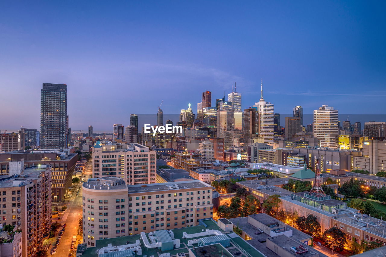 Modern buildings in city against sky