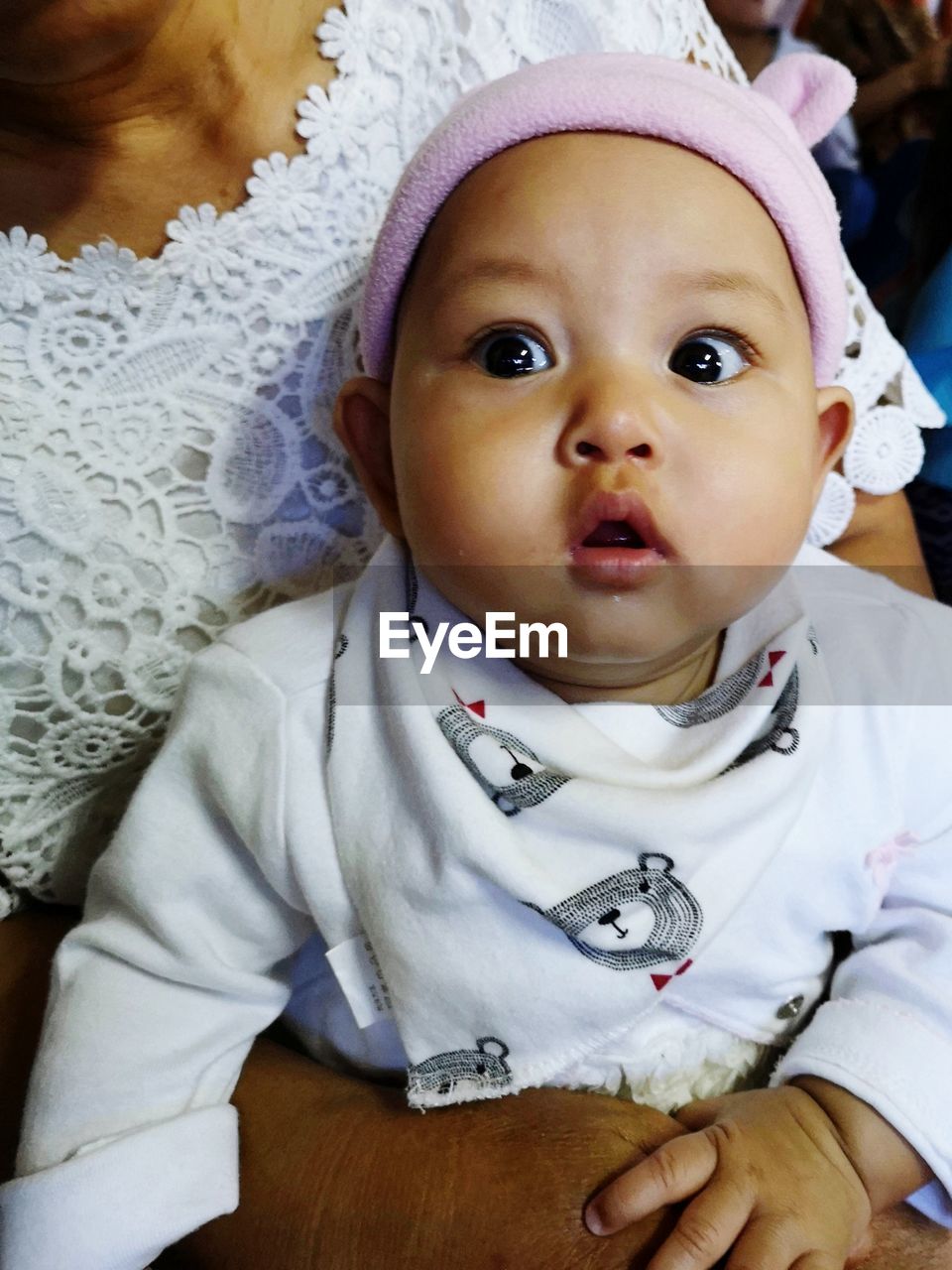 Close-up of cute baby girl at home