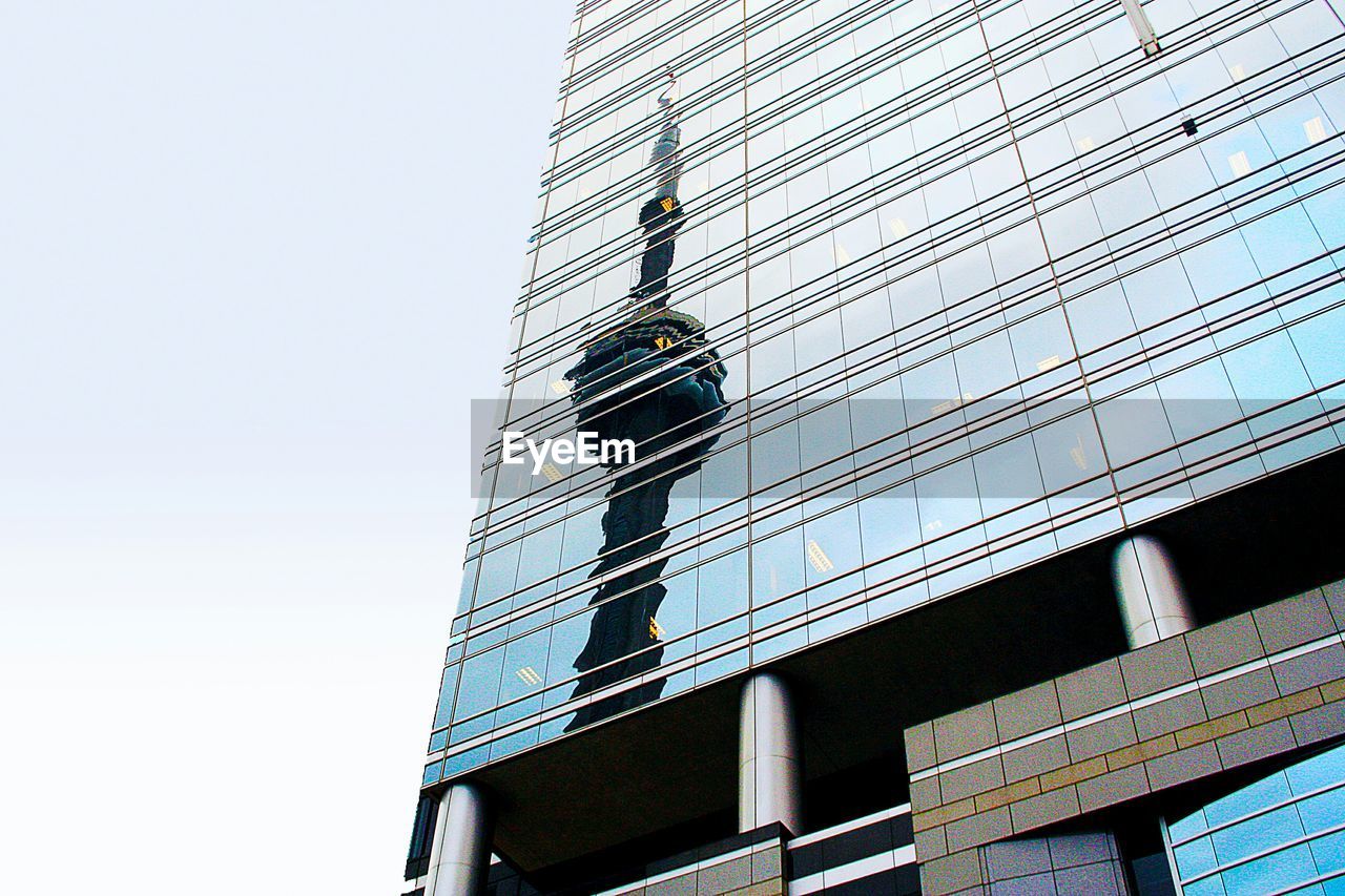 Low angle view of modern building against clear sky