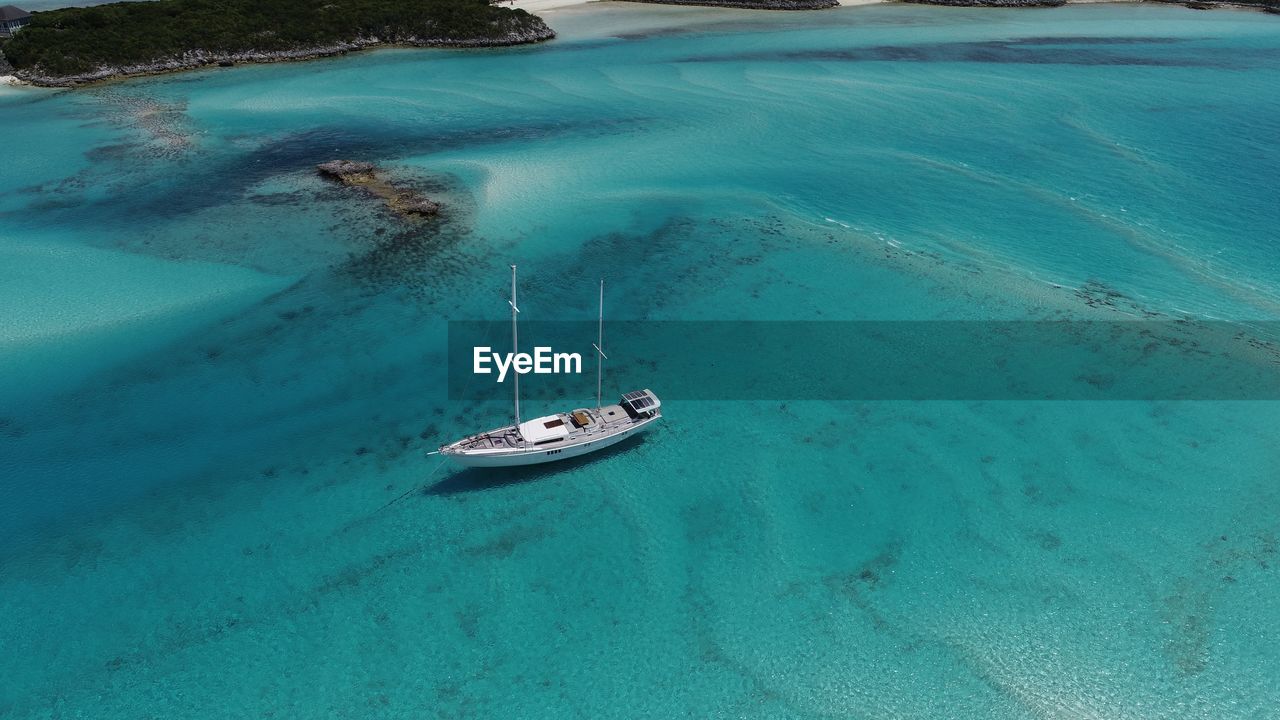 High angle view of sailboat sailing in sea