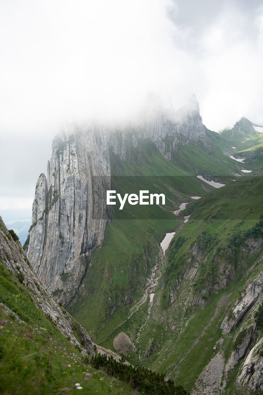 Scenic view of rocky mountains against sky