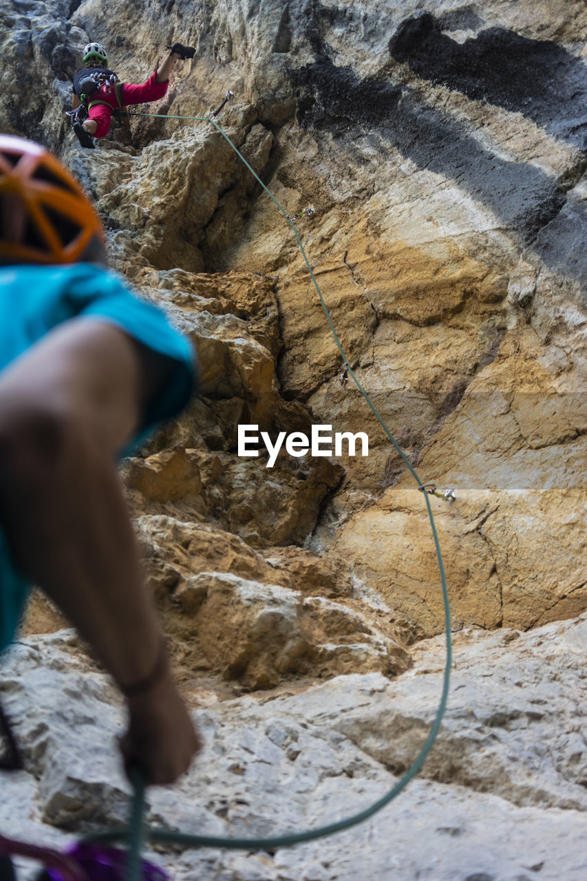 Belaying a climber