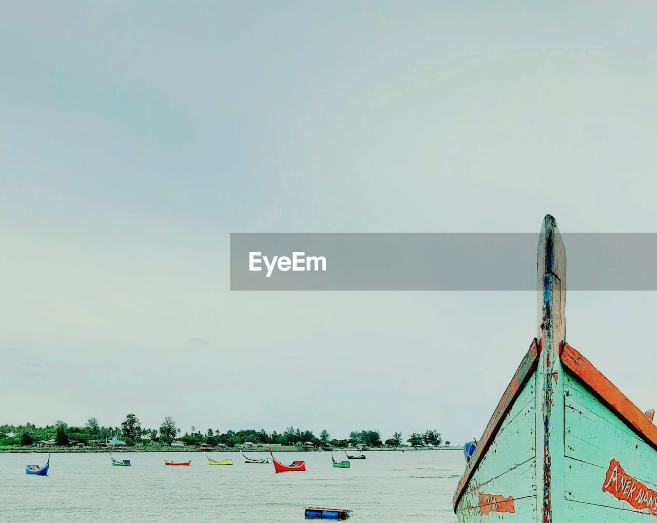 FISHING BOAT ON BEACH AGAINST SKY