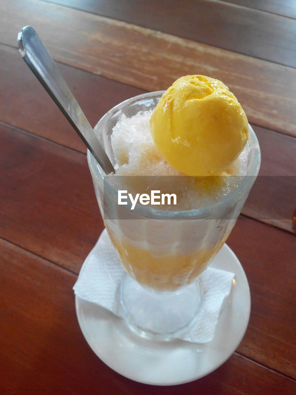 High angle view of maiz con hielo with mango ice cream served on table