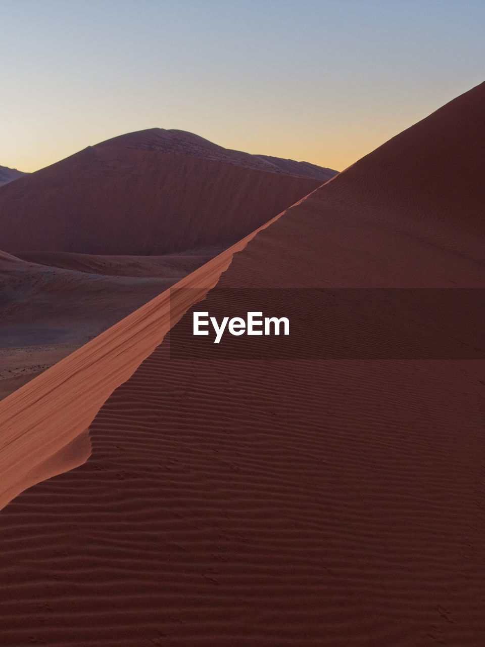 Scenic view of desert against clear sky