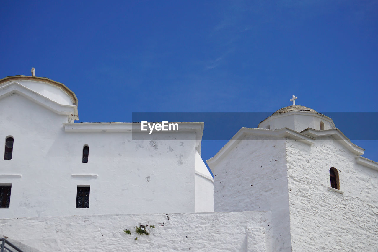 Low angle view of church against clear blue sky